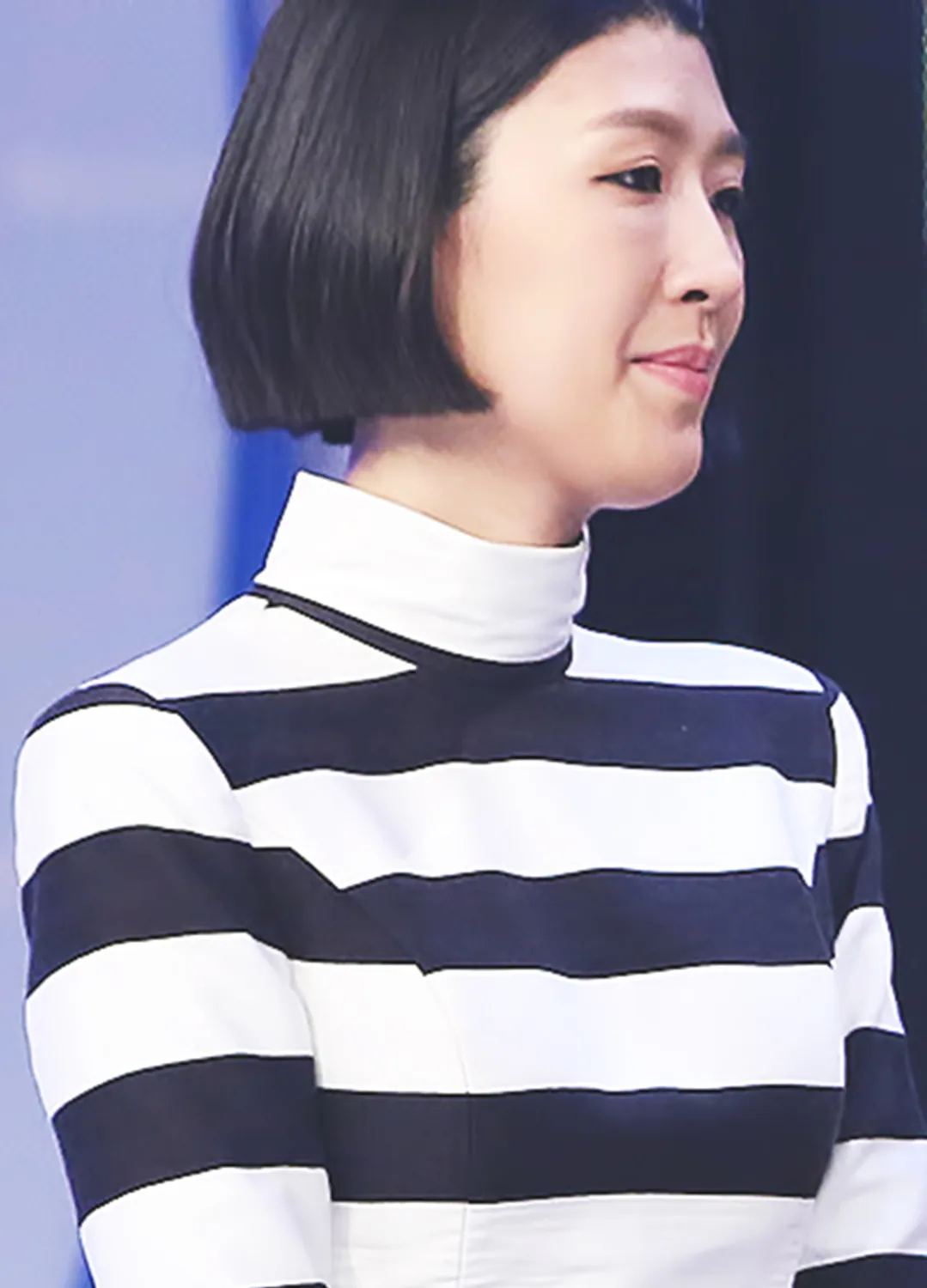 Hong Jin-kyung with a sleek black bob and a black-and-white striped high-neck top at an awards show